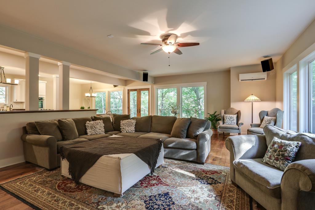 7833 Fernvale Road Fairview, TN 37062 - Photo 8 of 30 a living room with furniture ceiling fan and a rug