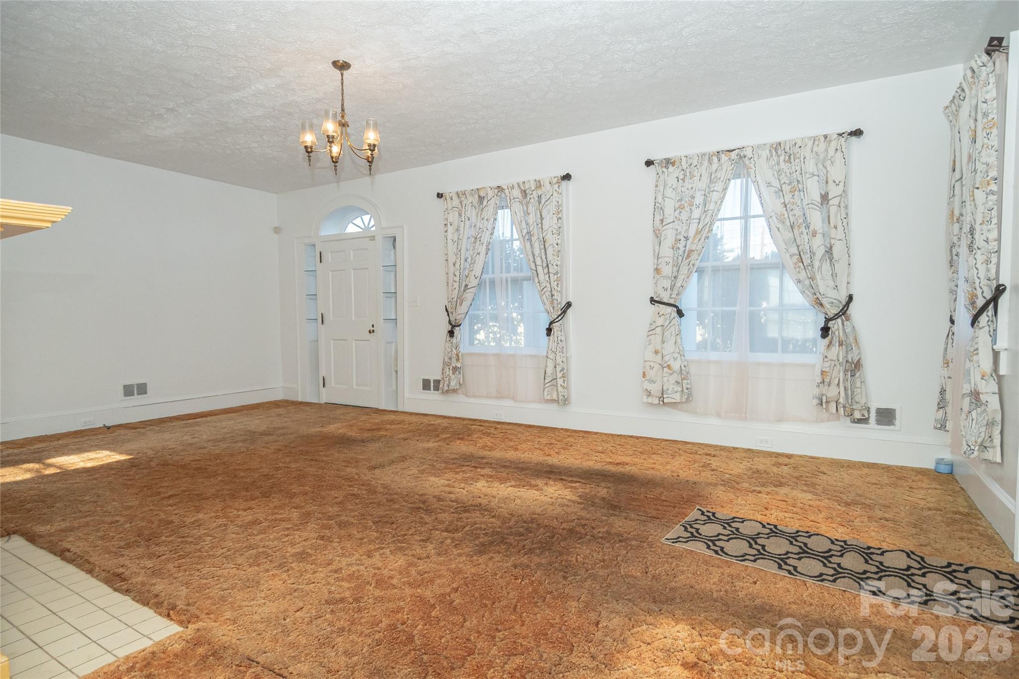 615 Carbon City Road Morganton, NC 28655 - Photo 16 of 42 a view of an empty room with a window