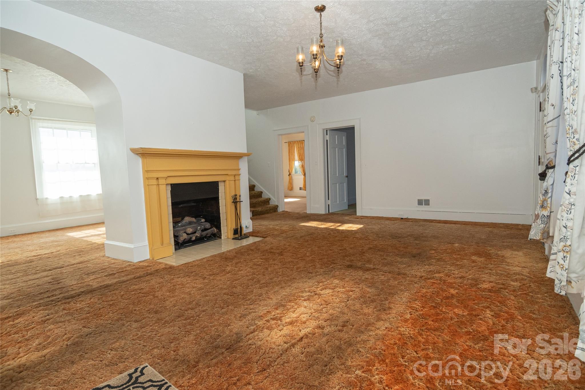 615 Carbon City Road Morganton, NC 28655 - Photo 18 of 42 a view of empty room with a fireplace