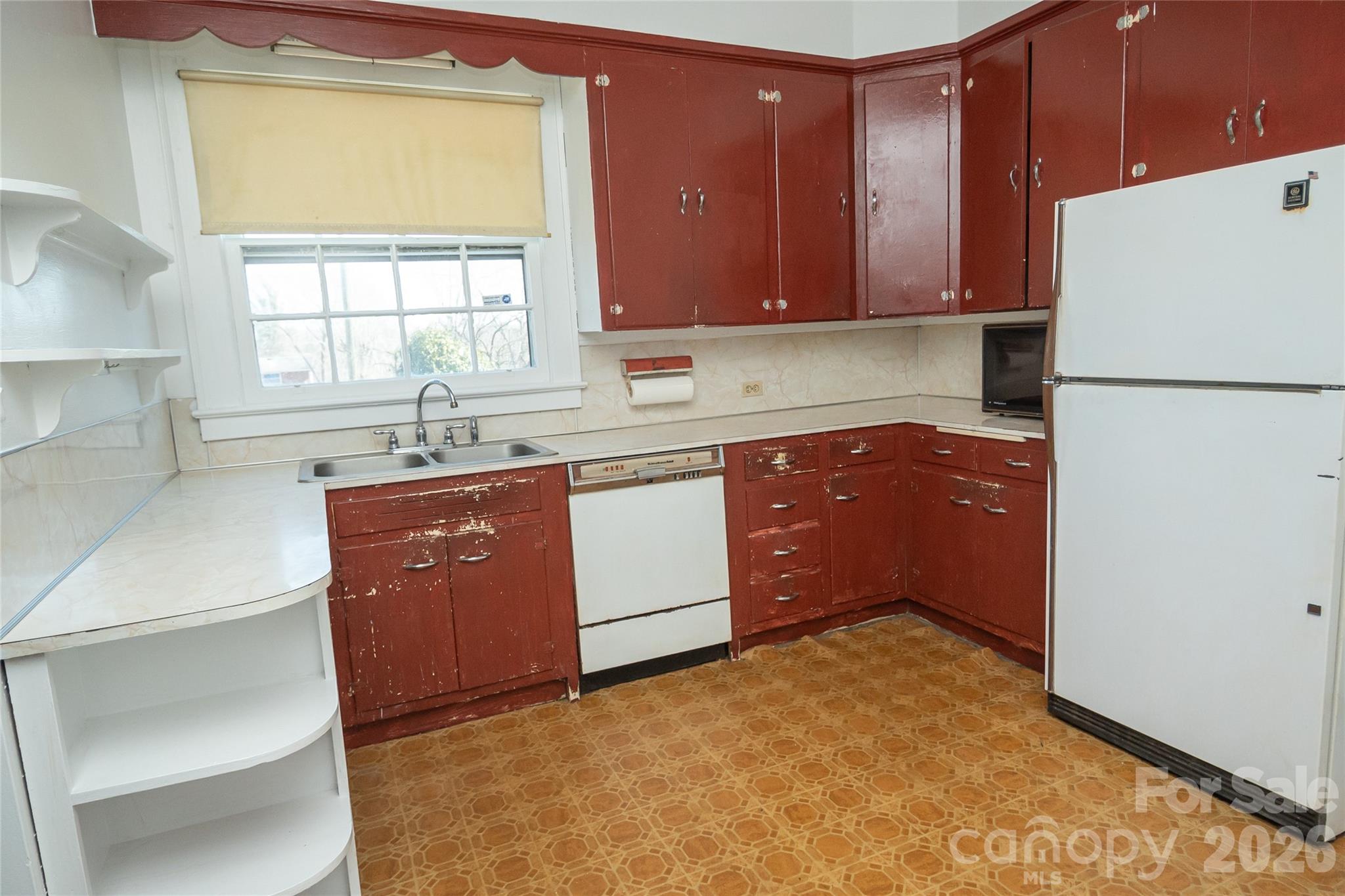 615 Carbon City Road Morganton, NC 28655 - Photo 19 of 42 a kitchen with stainless steel appliances granite countertop a refrigerator a sink dishwasher a stove with wooden cabinets and floor