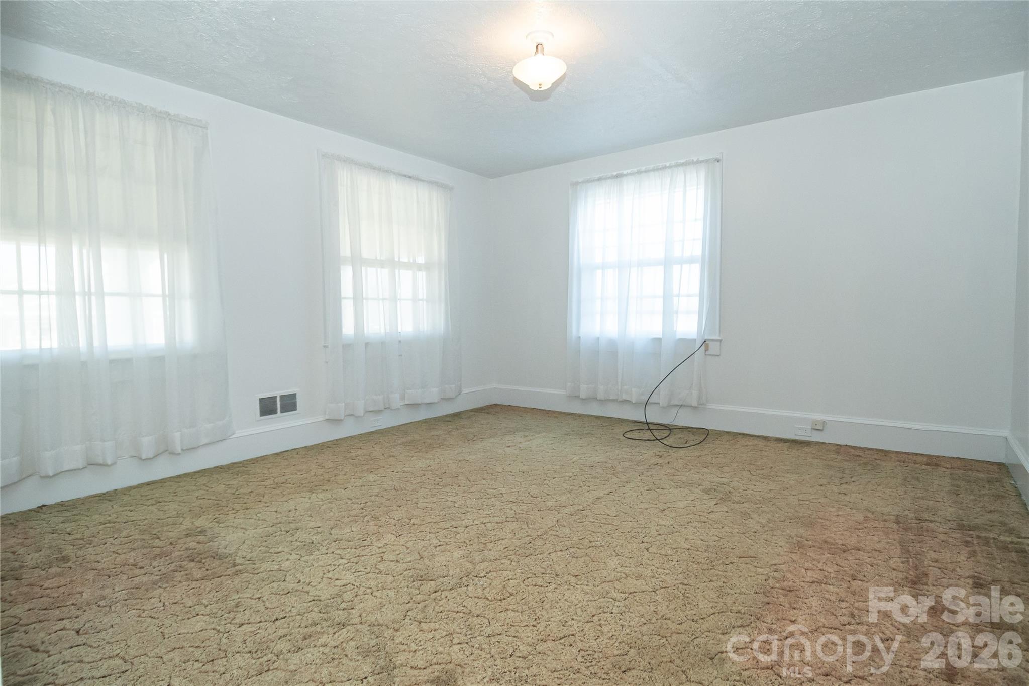 615 Carbon City Road Morganton, NC 28655 - Photo 22 of 42 an empty room with a window
