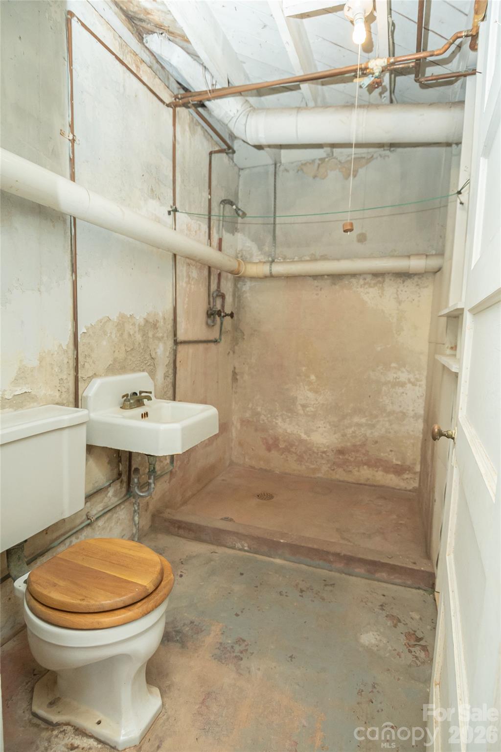615 Carbon City Road Morganton, NC 28655 - Photo 38 of 42 a bathroom with a sink a toilet and shower