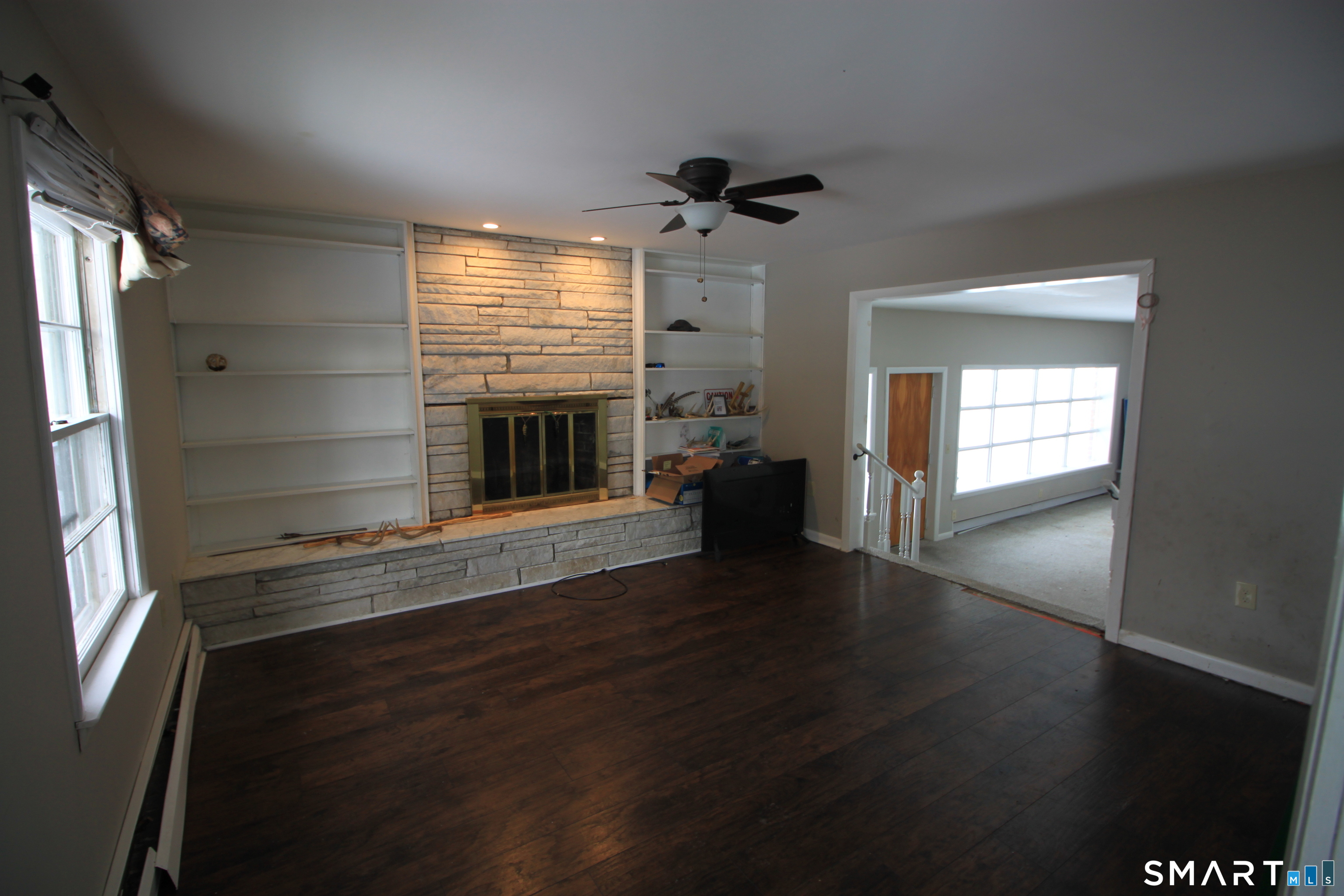 11 Old Fairwood Road Bethany, CT 06524 - Photo 12 of 20 an empty room with wooden floor and windows