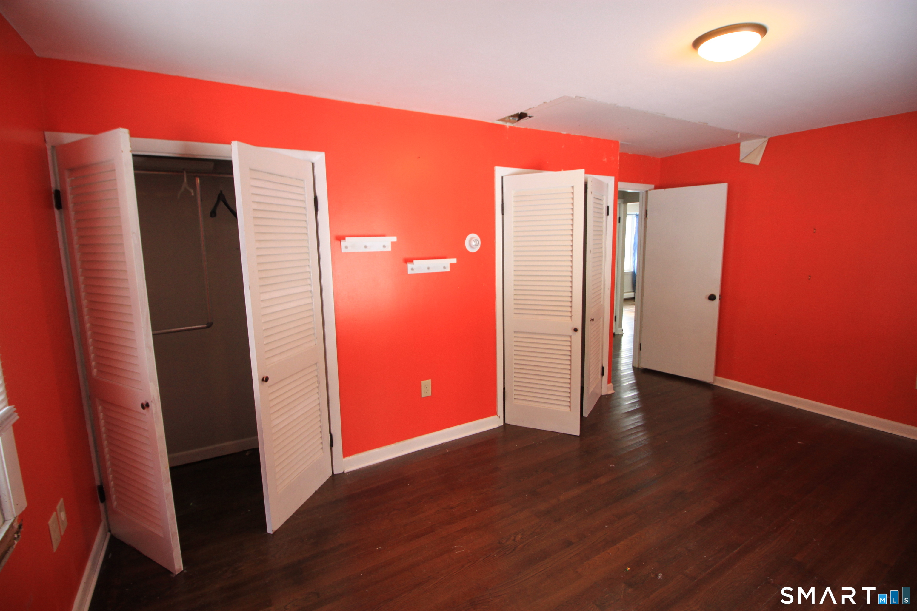 11 Old Fairwood Road Bethany, CT 06524 - Photo 17 of 20 an empty room with wooden floor and closet