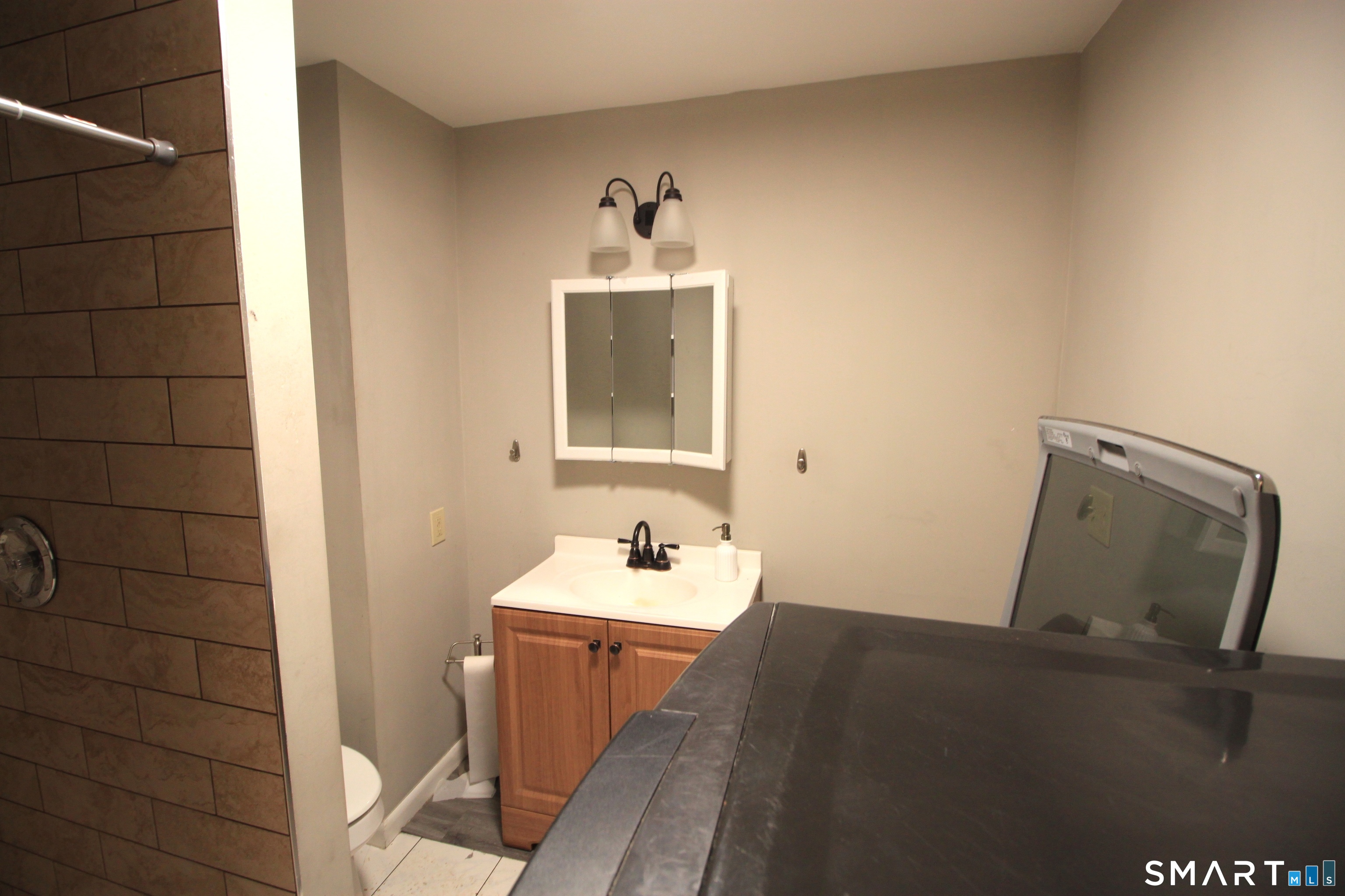 11 Old Fairwood Road Bethany, CT 06524 - Photo 19 of 20 a bathroom with a sink a mirror and vanity