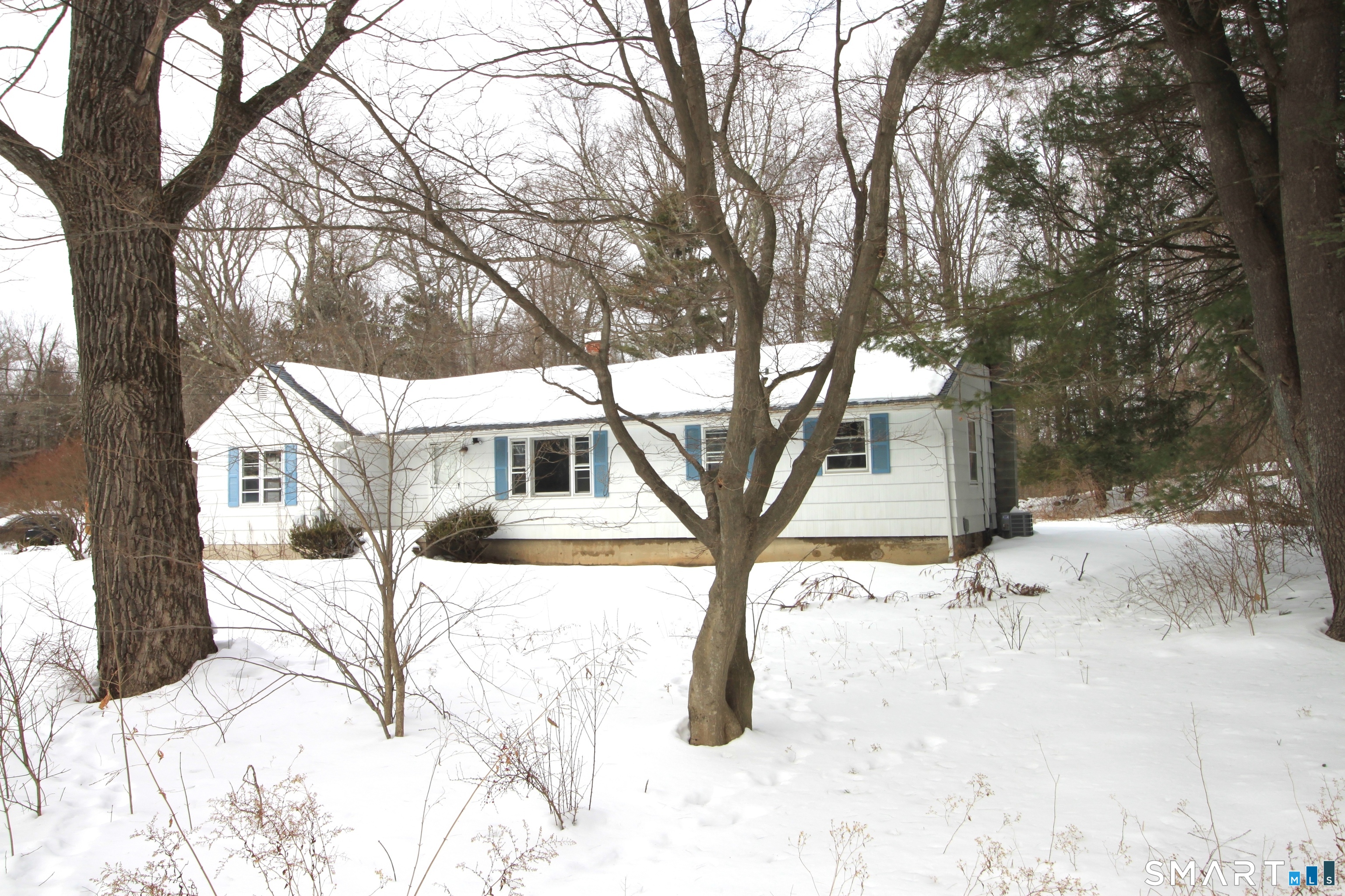 11 Old Fairwood Road Bethany, CT 06524 - Photo 4 of 20 a white house that has a tree in the background
