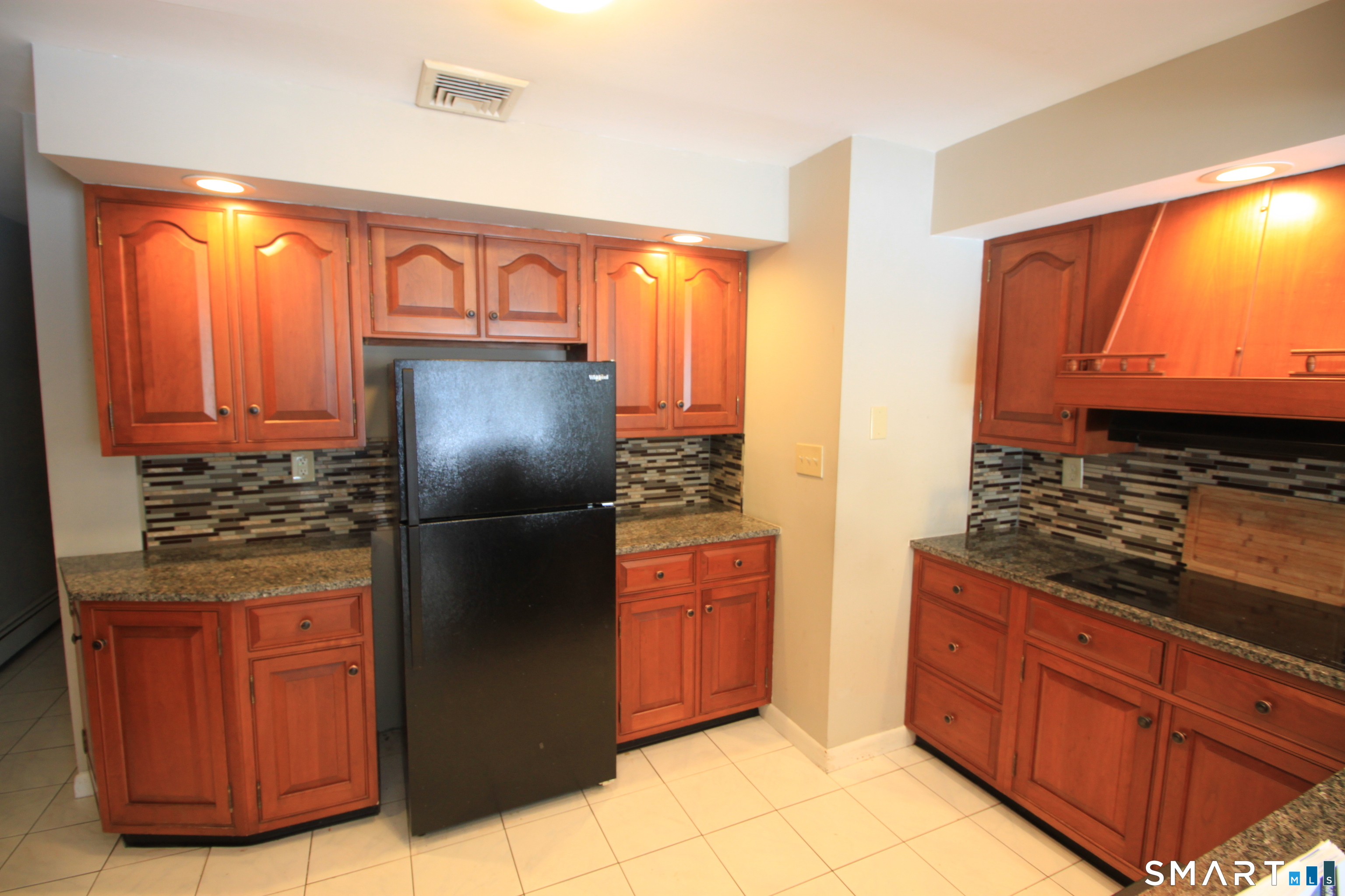 11 Old Fairwood Road Bethany, CT 06524 - Photo 6 of 20 a kitchen with stainless steel appliances granite countertop a refrigerator and a sink