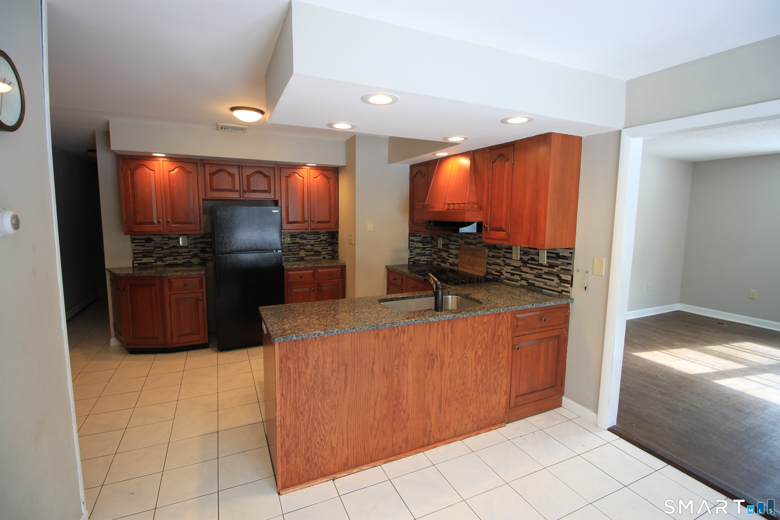 11 Old Fairwood Road Bethany, CT 06524 - Photo 8 of 20 a kitchen with stainless steel appliances granite countertop a refrigerator and a stove