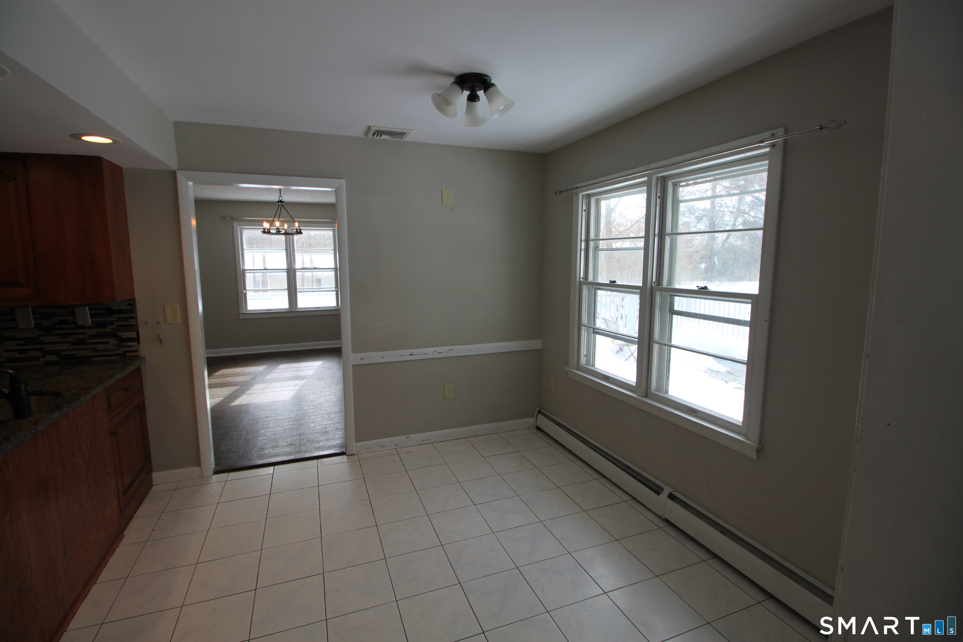 11 Old Fairwood Road Bethany, CT 06524 - Photo 9 of 20 a view of an empty room with a kitchen
