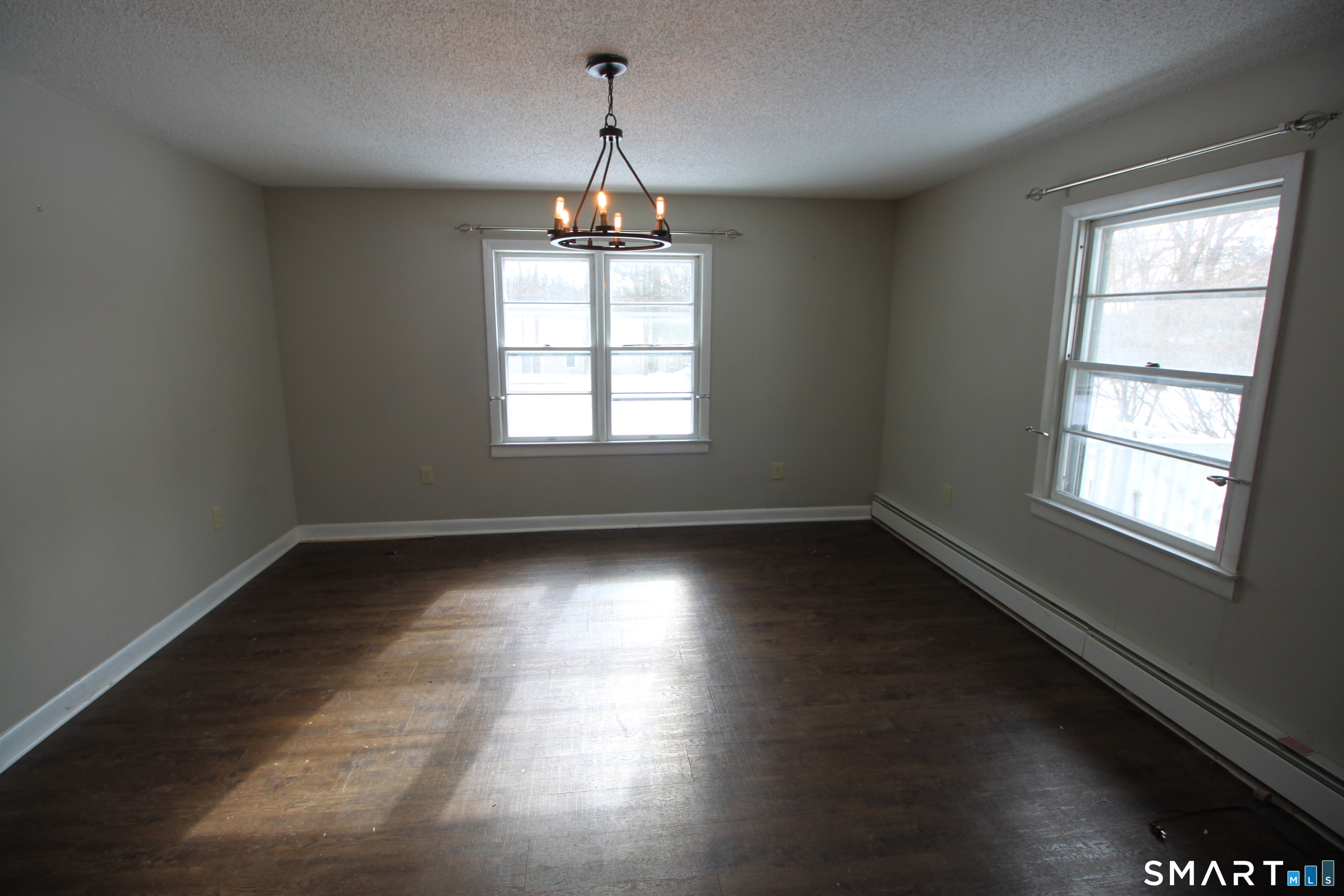 11 Old Fairwood Road Bethany, CT 06524 - Photo 10 of 20 an empty room with wooden floor and windows