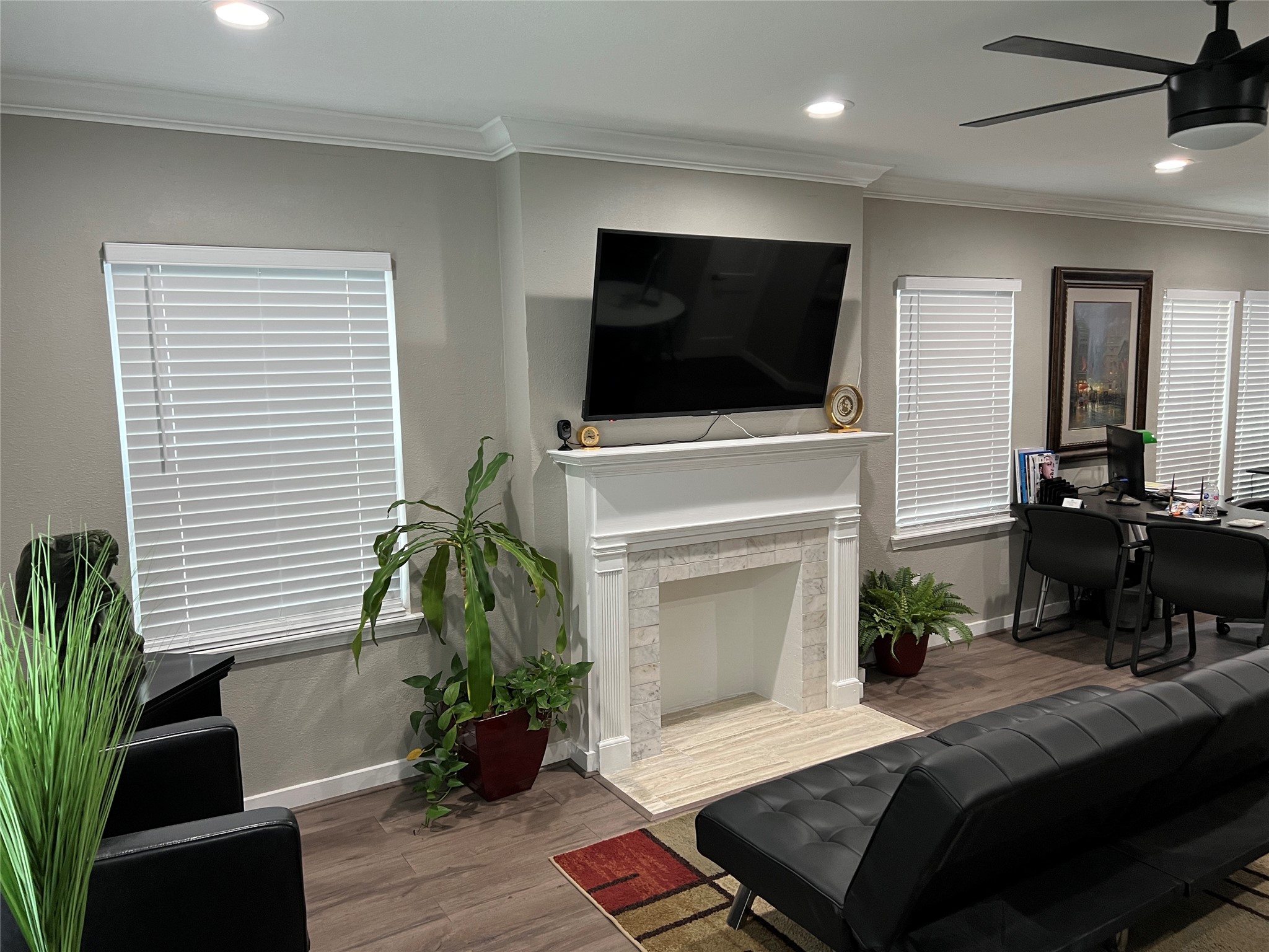 1909 Ruth Street Houston, TX 77004 - Photo 22 of 35 a living room with furniture a flat screen tv and a fireplace