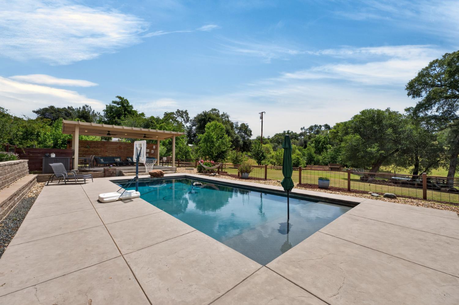 4920 Upson Downs Road Newcastle, CA 95658 - Photo 4 of 98 Pebbletec pool with cabo bench and patio cover