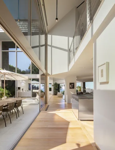 a lobby with furniture and a kitchen