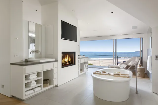 a living room with a fireplace and a fireplace