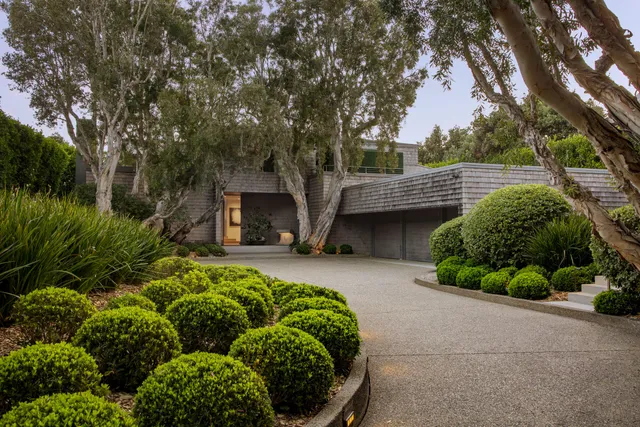 a backyard of a house with lots of green space
