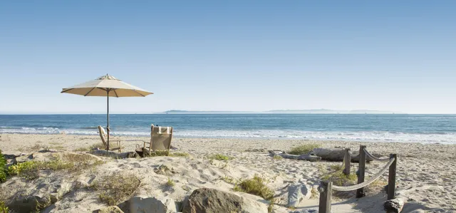 a bed room with a bed and a chair