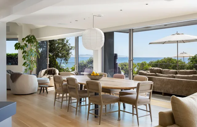 a view of a dining room with furniture window and outside view
