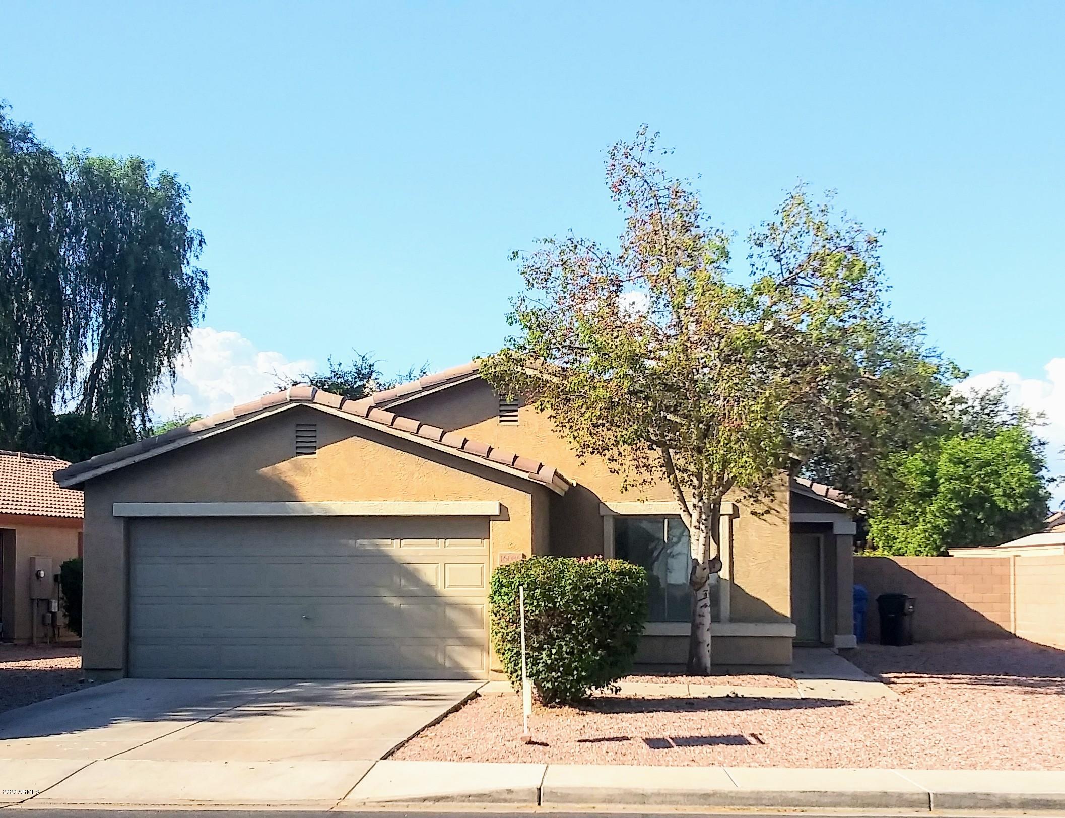 16086 West Calavar Road Surprise, AZ 85379 - Photo 1 of 28 a view of a house with a tree