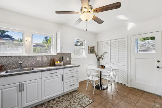 a kitchen with sink cabinets and window
