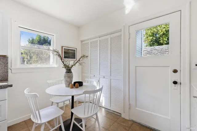 a view of a livingroom with furniture and a window