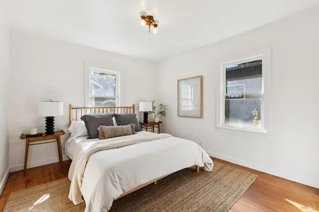 a bedroom with double bed and a window
