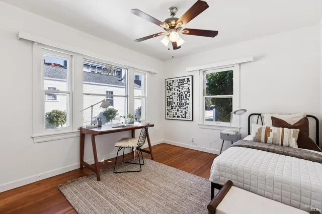 a bedroom with a bed and a table