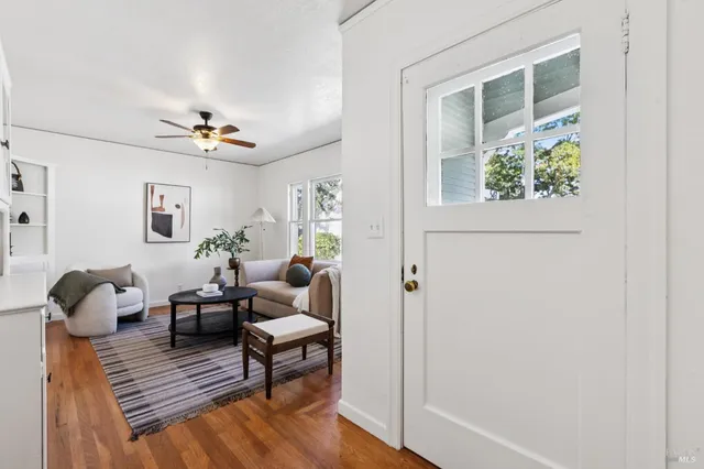 a living room with furniture and a window