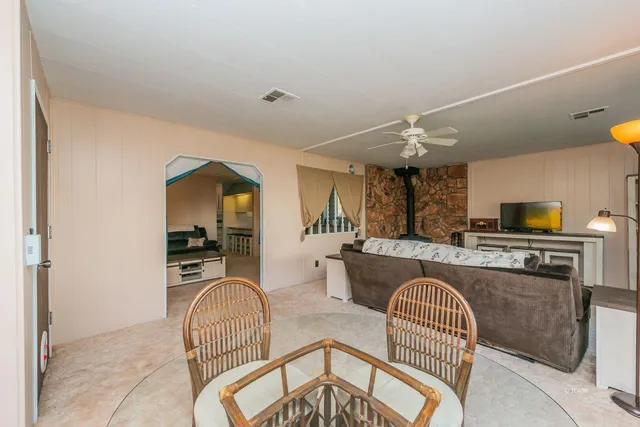 a living room with furniture and a rug