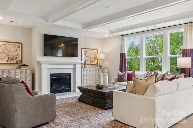 a spacious bedroom with a bed and ceiling fan