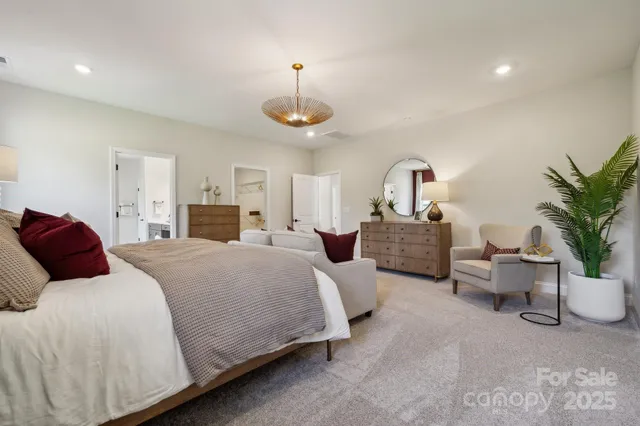 a living room with fireplace furniture and a large window