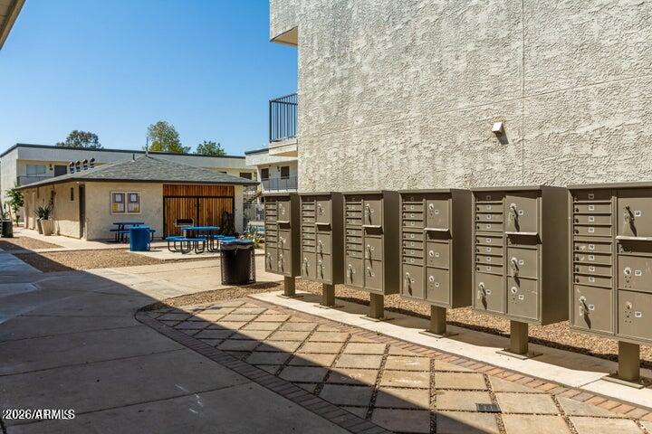 18202 North Cave Creek Road, Unit 212 Phoenix, AZ 85032 - Photo 7 of 12 a view of a building with many windows