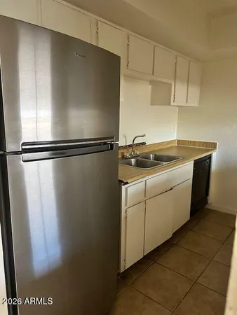 a stove top oven sitting inside of a kitchen