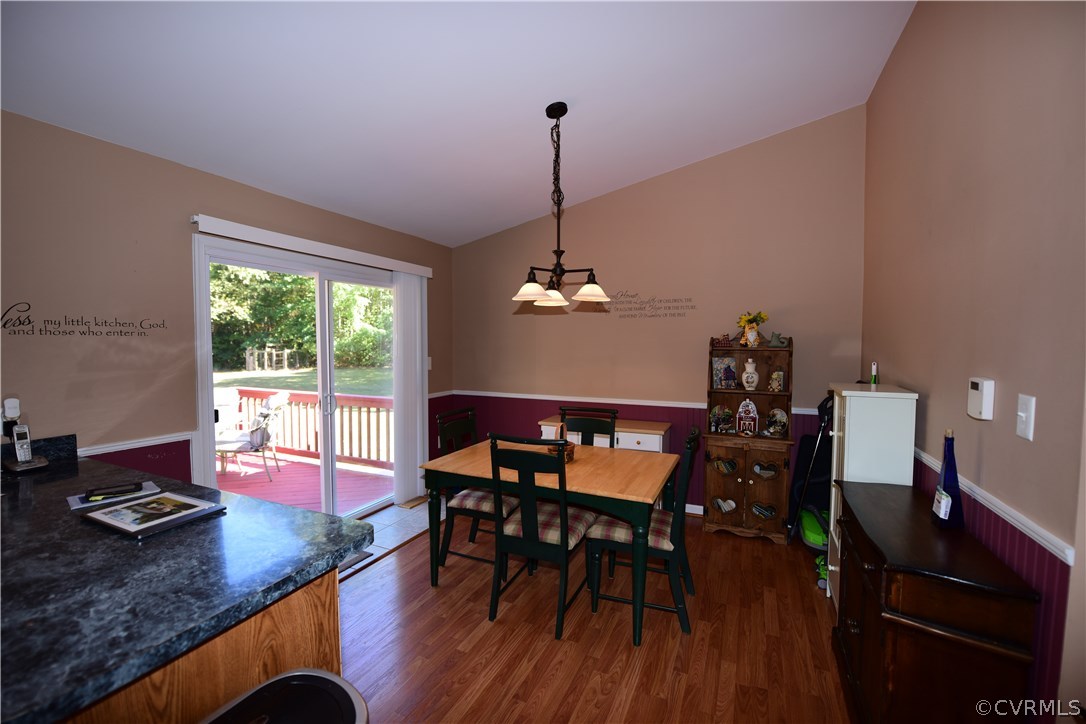 20820 Beaver Dam Road Beaverdam, VA 23015 - Photo 14 of 26 a dining room with furniture a chandelier and wooden floor