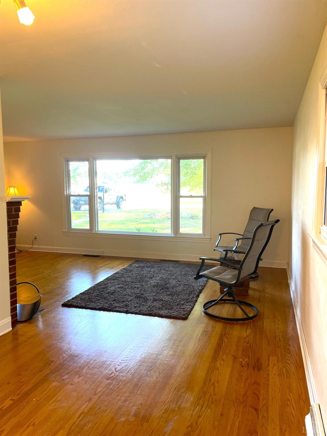 6181 Renan Road Hurt, VA 24563 - Photo 14 of 35 a living room with hardwood floor furniture and a window