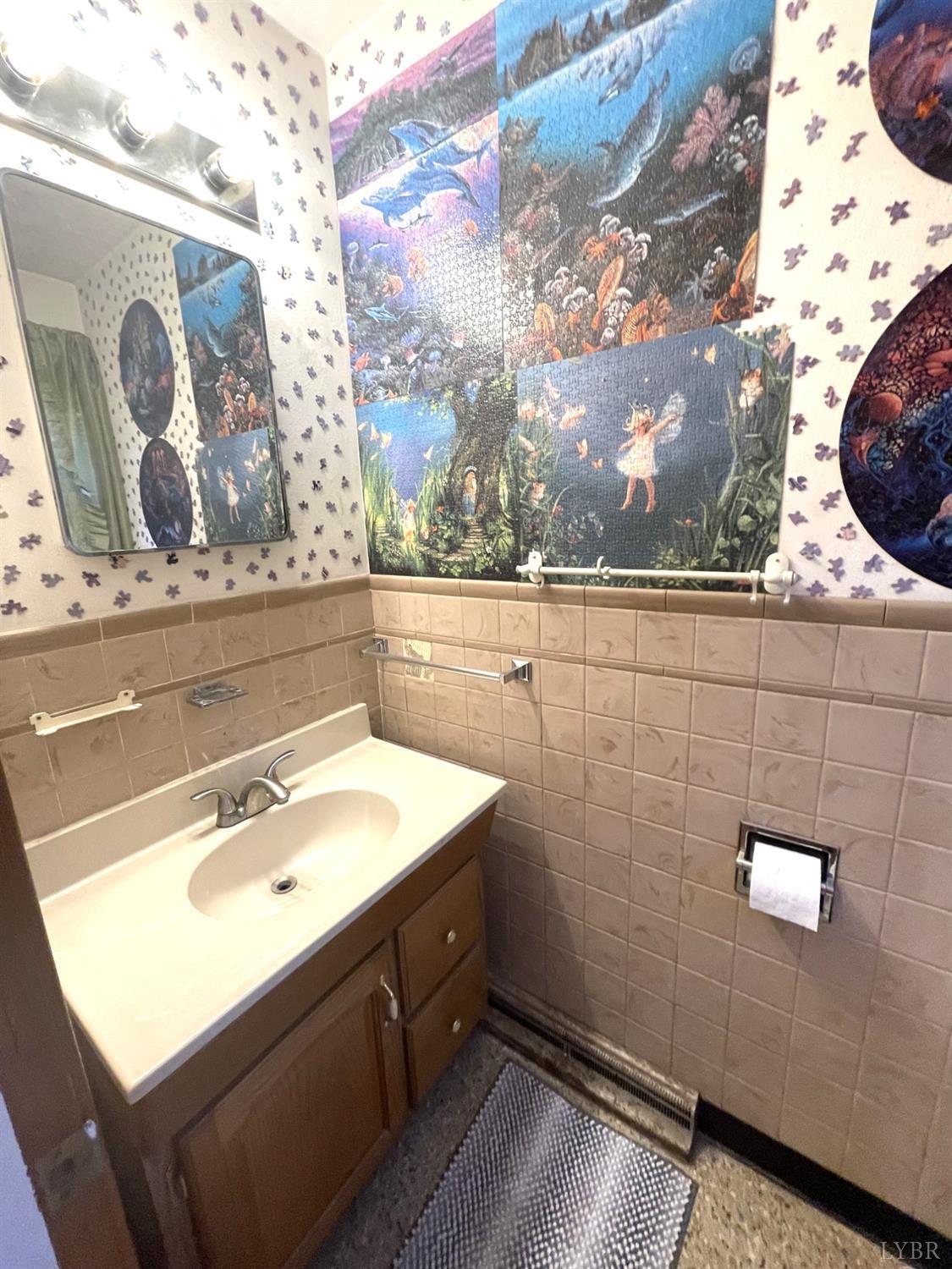 6181 Renan Road Hurt, VA 24563 - Photo 27 of 35 a bathroom with a sink and mirror
