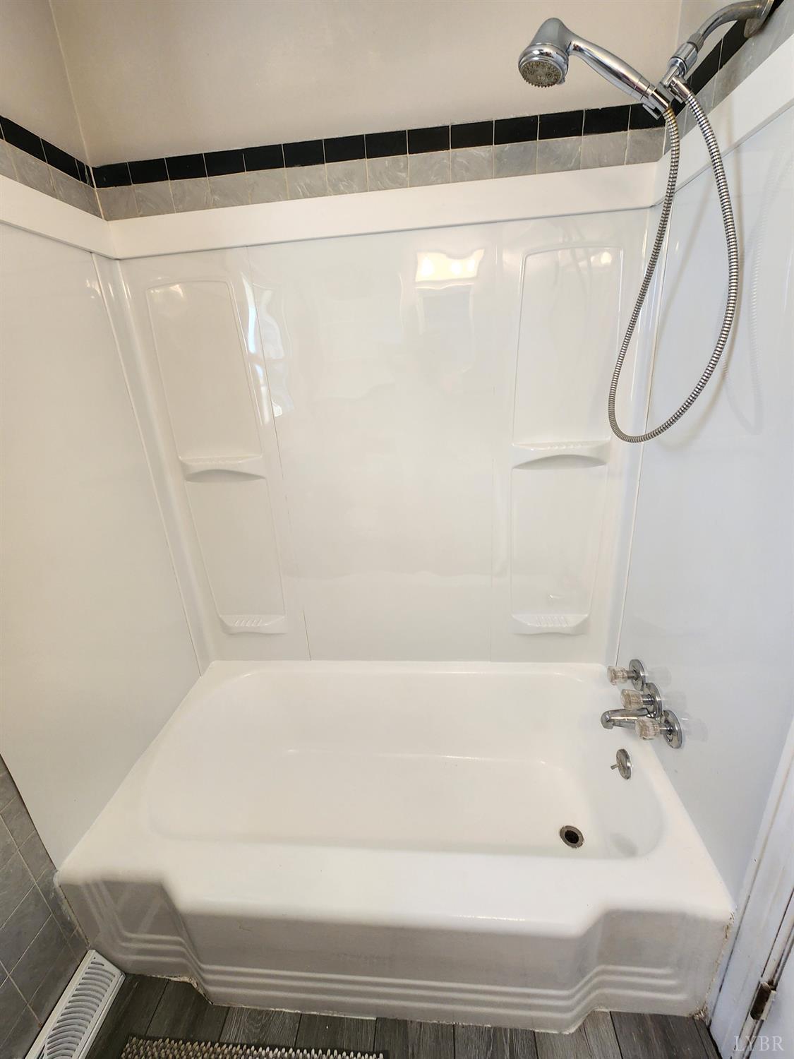 6181 Renan Road Hurt, VA 24563 - Photo 6 of 35 a bathroom with a bathtub and a shower
