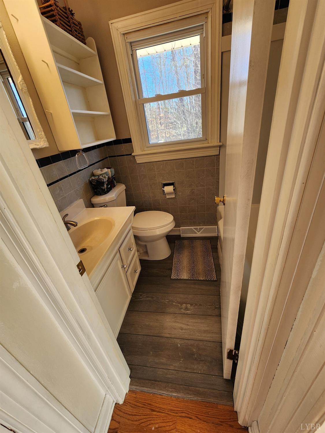 6181 Renan Road Hurt, VA 24563 - Photo 8 of 35 a bathroom with a sink a toilet and a window