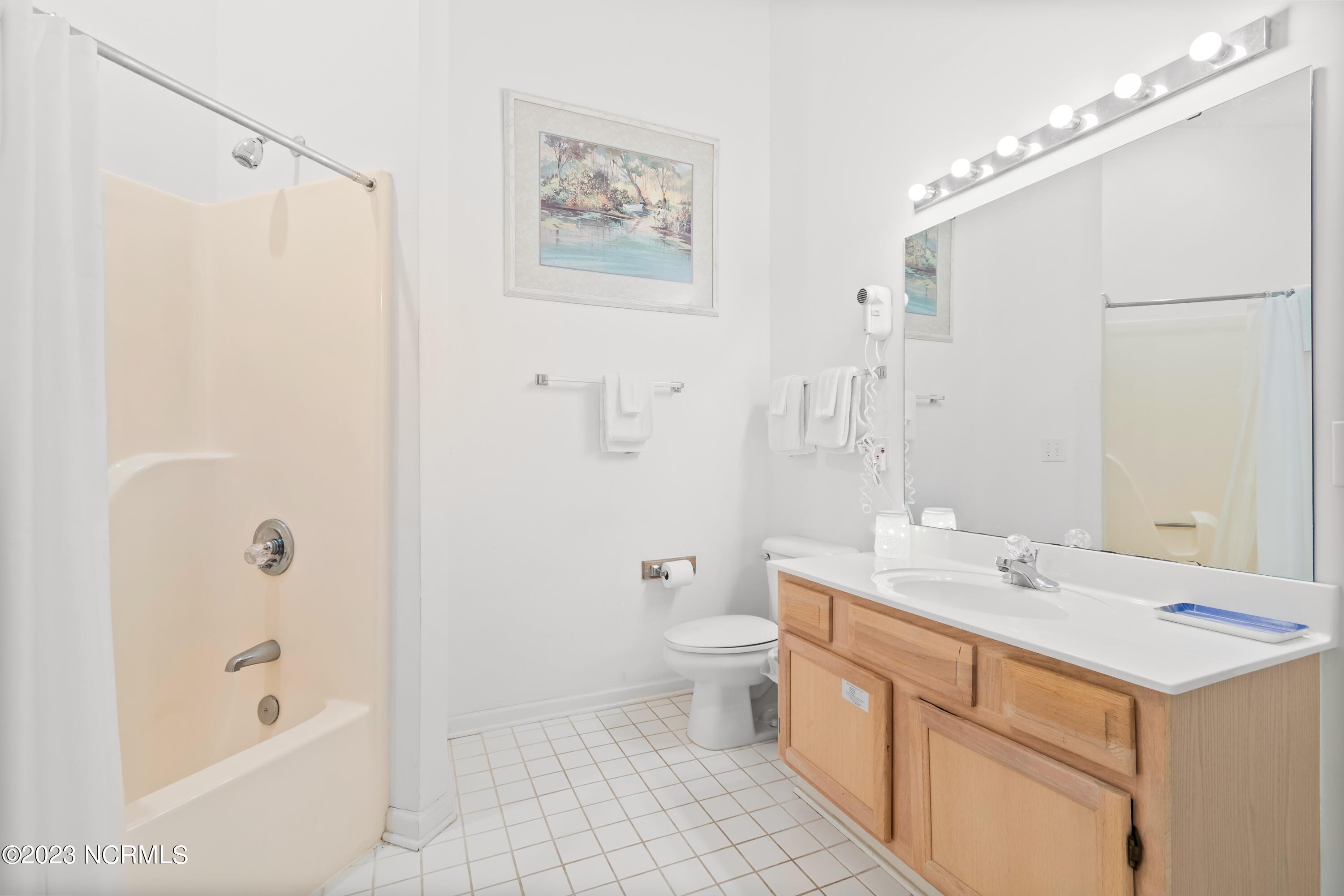 226 Clubhouse Road, Unit 17D Sunset Beach, NC 28468 - Photo 29 of 37 This large master bathroom is located on the upper level.