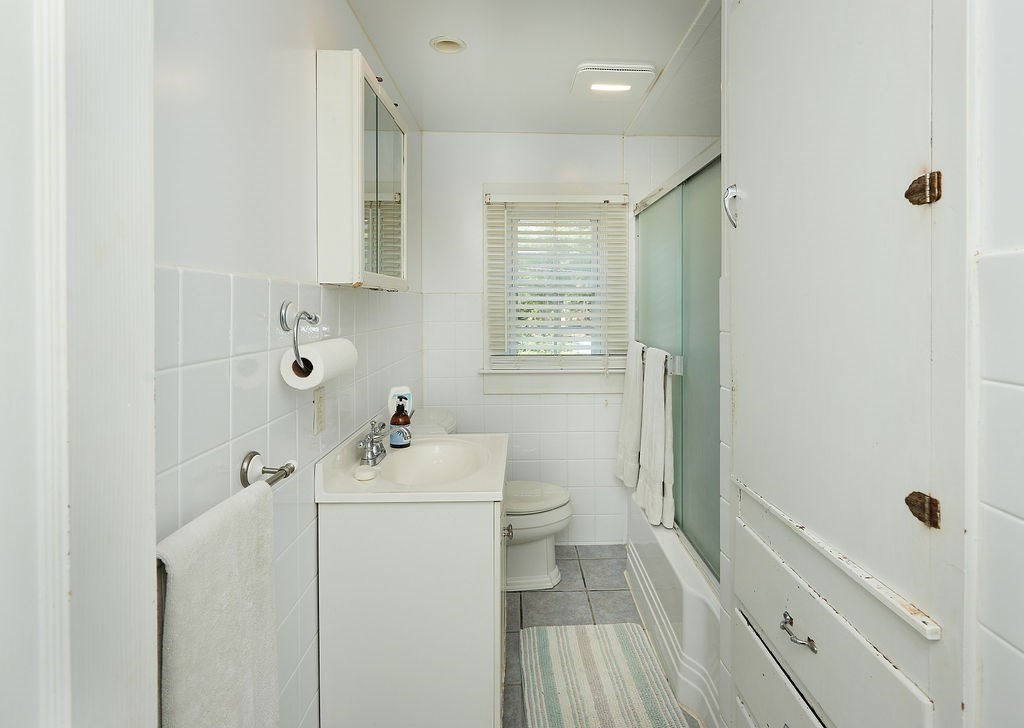 738 Sandwich Road Bourne, MA 02532 - Photo 17 of 25 a bathroom with a sink a toilet and shower