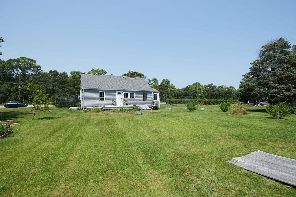 738 Sandwich Road Bourne, MA 02532 - Photo 19 of 25 a view of a house with a big yard