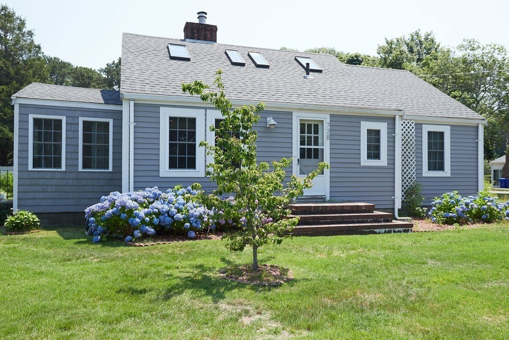 738 Sandwich Road Bourne, MA 02532 - Photo 3 of 25 a front view of a house with a garden