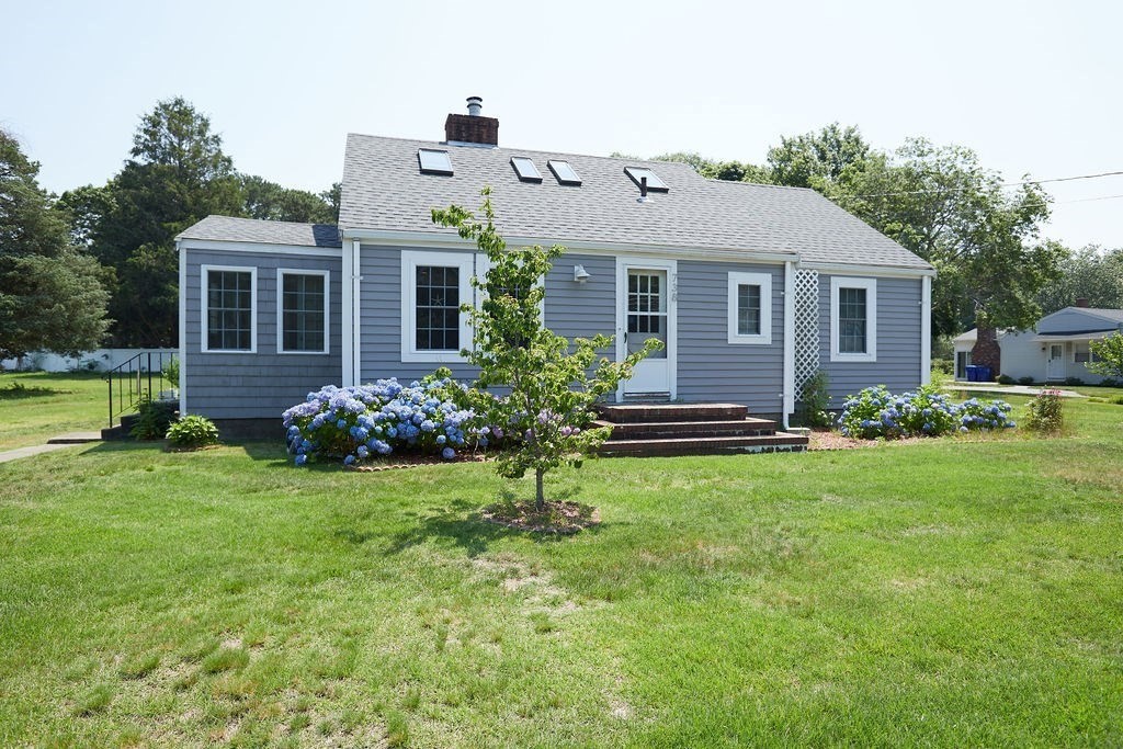 738 Sandwich Road Bourne, MA 02532 - Photo 4 of 25 a front view of house with yard and green space
