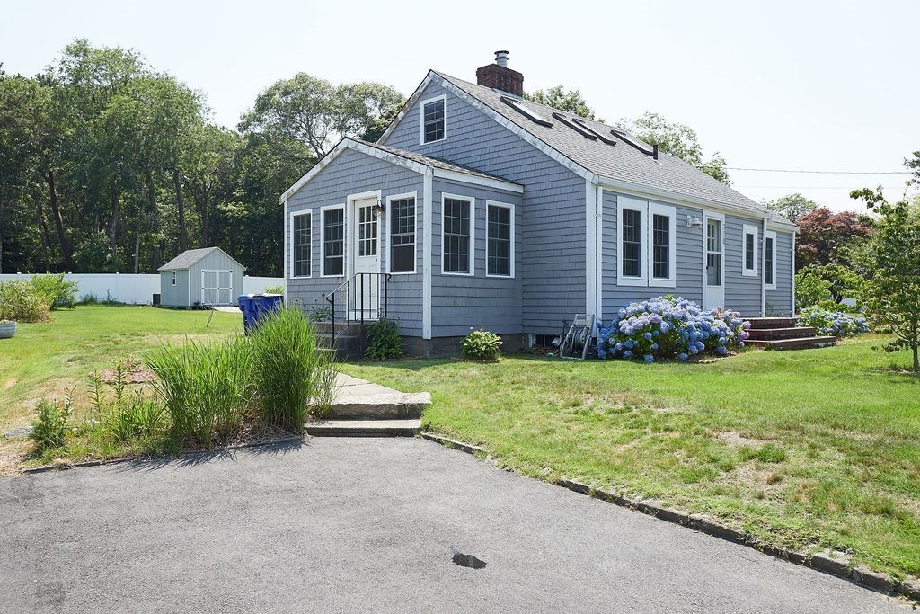 738 Sandwich Road Bourne, MA 02532 - Photo 7 of 25 a front view of house with yard and green space