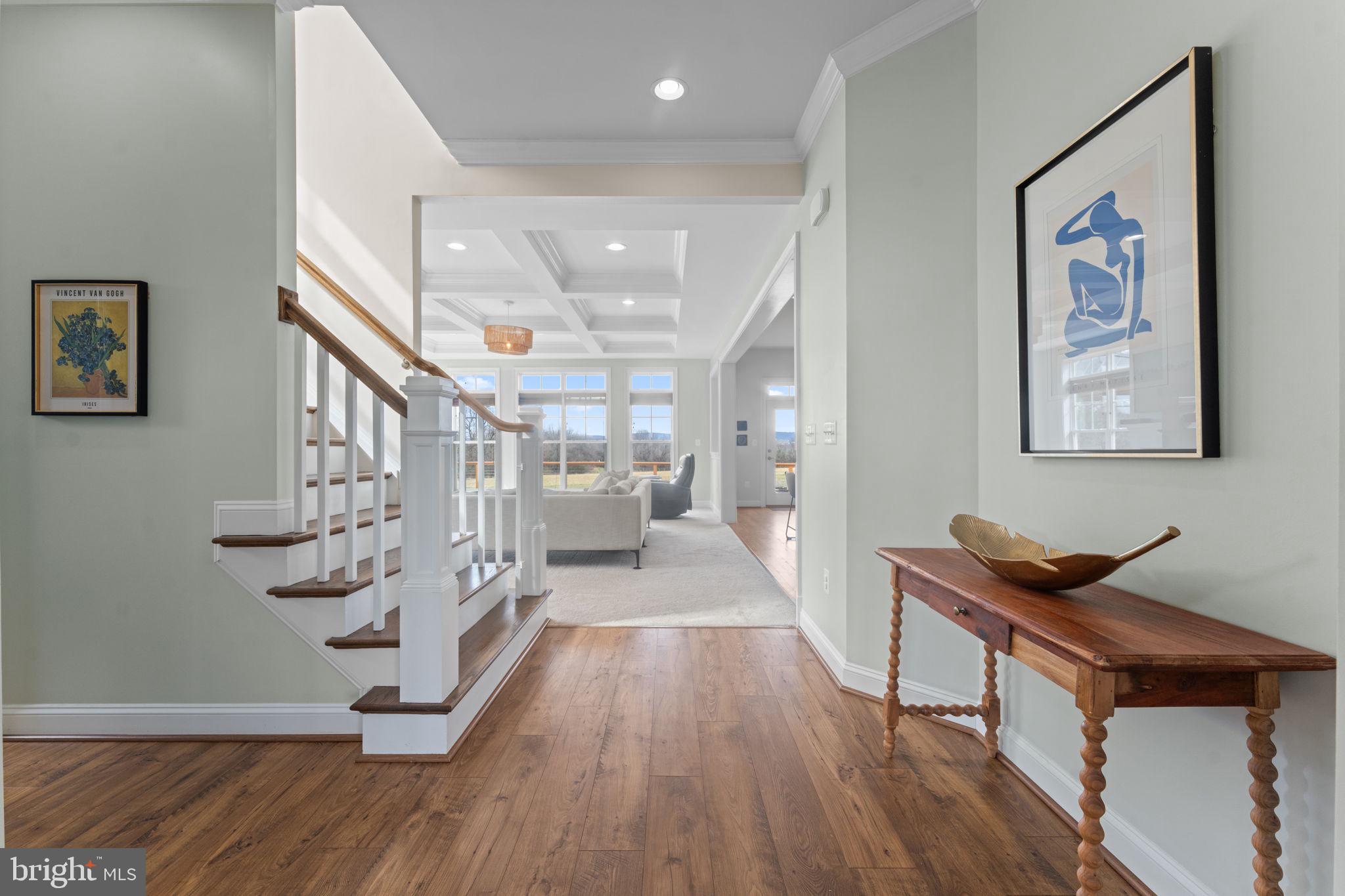 16756 Misty Ridge Lane Purcellville, VA 20132 - Photo 17 of 92 a view of a hallway with wooden floor and staircase