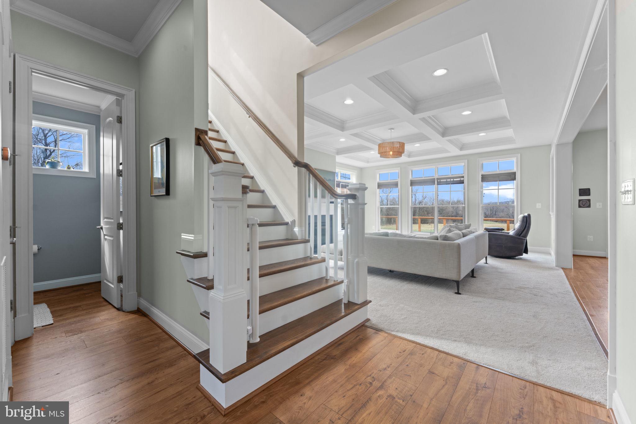 16756 Misty Ridge Lane Purcellville, VA 20132 - Photo 18 of 92 a view of front door with hallway and wooden floor