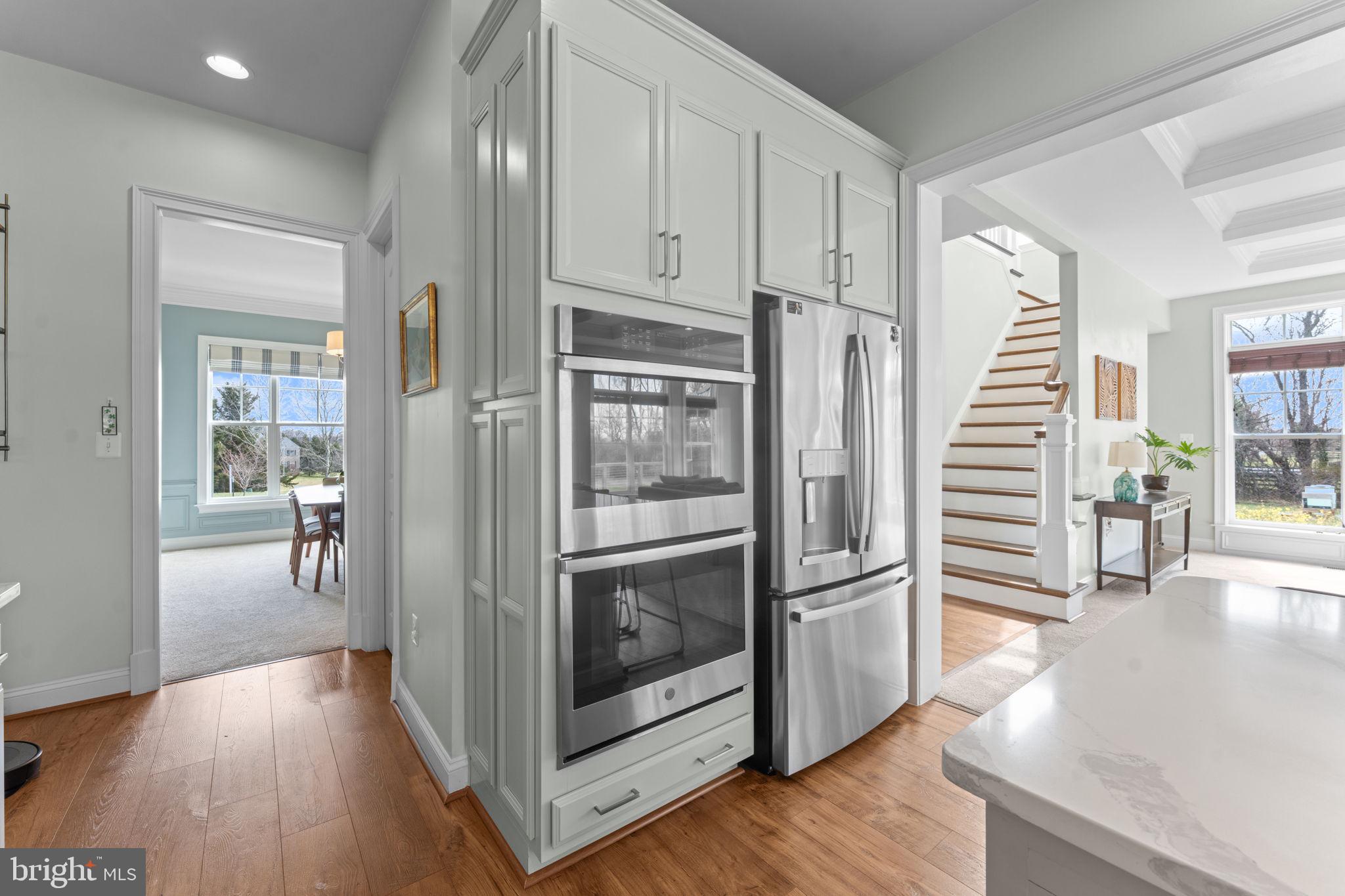 16756 Misty Ridge Lane Purcellville, VA 20132 - Photo 31 of 92 a kitchen with stainless steel appliances granite countertop a refrigerator and a stove