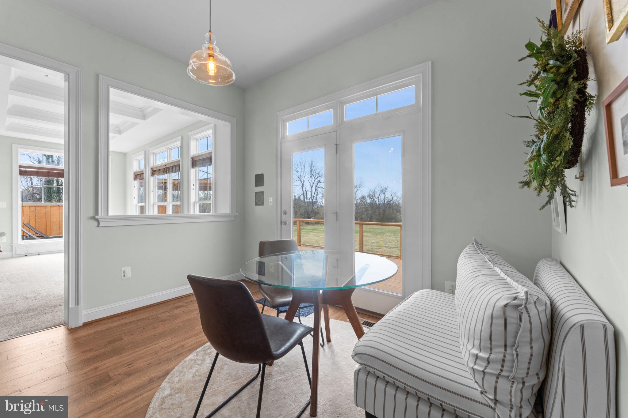 16756 Misty Ridge Lane Purcellville, VA 20132 - Photo 34 of 92 a view of a dining room with furniture wooden floor and chandelier