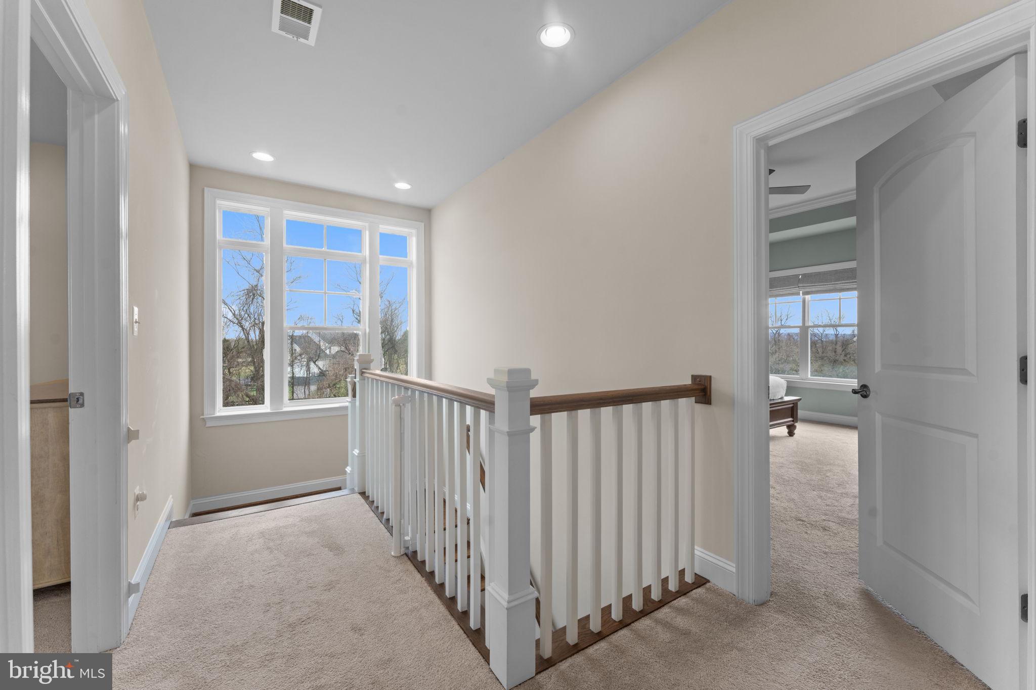 16756 Misty Ridge Lane Purcellville, VA 20132 - Photo 40 of 92 a view of a hallway with windows