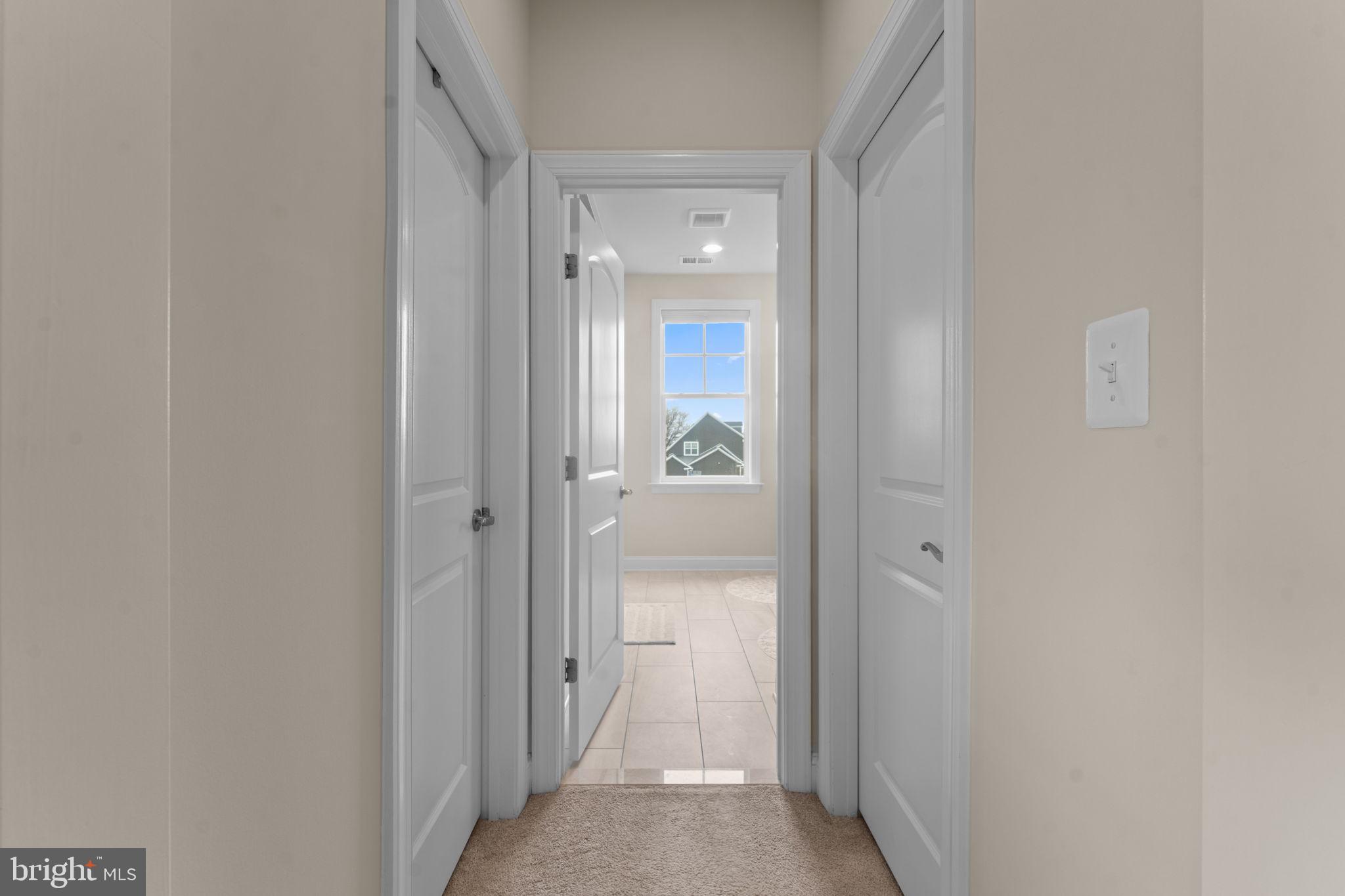 16756 Misty Ridge Lane Purcellville, VA 20132 - Photo 44 of 92 a view of a bathroom from a hallway