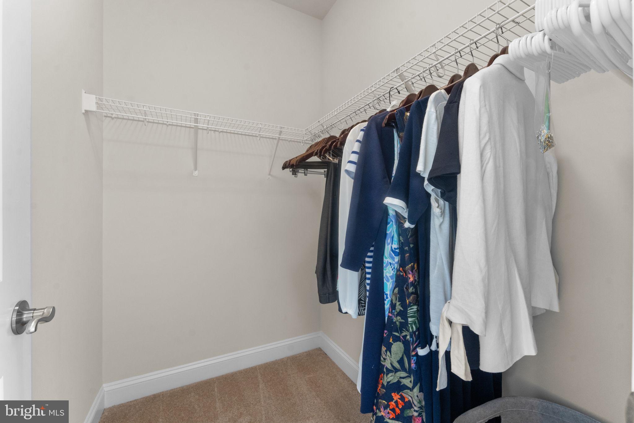 16756 Misty Ridge Lane Purcellville, VA 20132 - Photo 55 of 92 a view of walk in closet with clothes